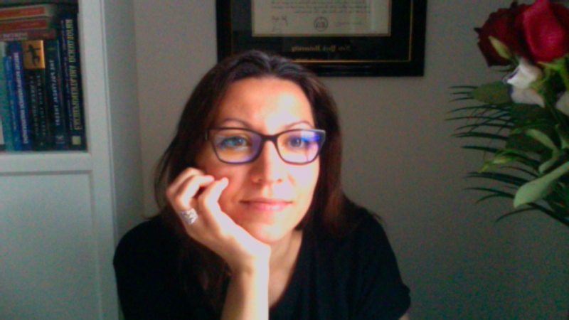 Portrait of Tanya Anpilogova, looking into the camera, slightly smiling